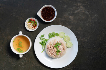Sliced Hainan-style chicken with marinated rice and soup (Khao Mun Kai)or steamed chicken rice - Asian food style