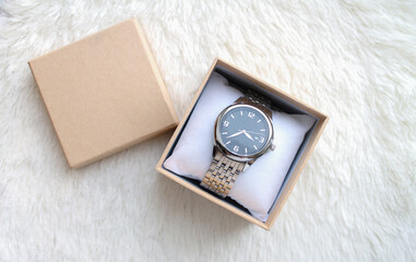 Luxury male wristwatches in gift box or case top view