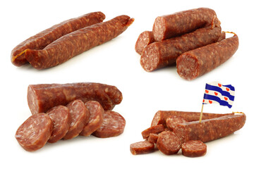 Traditional frisian dried sausage pieces and one with a dutch flag toothpick on a white background