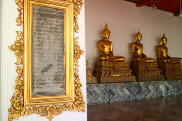 One of granite slabs engraved of knowledge encyclopedia being placed around the Temple of the Reclining Buddha, Bangkok, Thailand