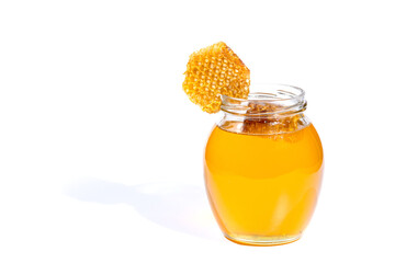 Glass jar with sweet honey isolated on white background