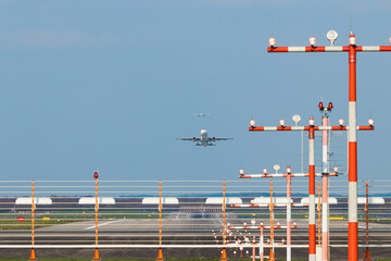 Düsseldorf Airport, Germany: Commercial passenger airplane during takeoff and landing. Landing...
