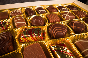 Chocolate pralines in close-up view - macro sliding shot - food photography