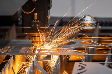 The fiber laser cutting machine cutting  machine cut the metal plate. The hi-technology sheet metal...