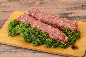 Raw minced beef kebab skewer