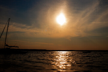 Fototapeta premium Fishing Boat at The Lake on Sunset