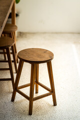 A classic wooden chair built from oak wood which is placed on the white floor. Interior object photo, Abstract feeling.