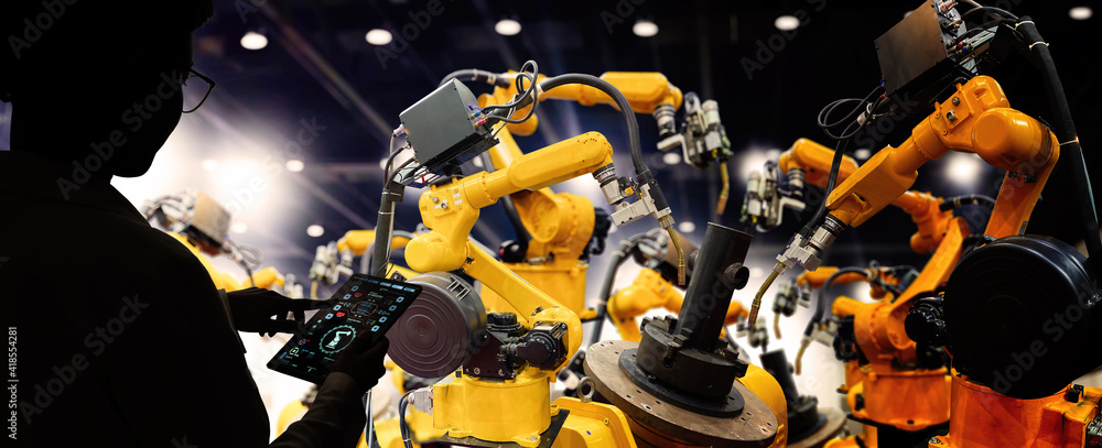 Poster Factory Female Industrial Engineer working with automation robot arms machine in intelligent factory industrial on real time monitoring system software.Digital future manufacture.
