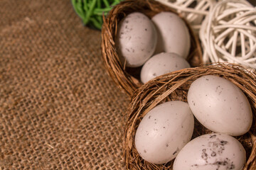nest with eggs on a sackcloth. Happy Easter eggs. Background with easter eggs.