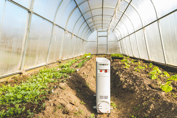 heater in a greenhouse, a concept of maintaining the required temperature in a greenhouse by means...