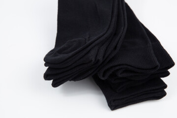 Black men's socks made of cotton on a white background.