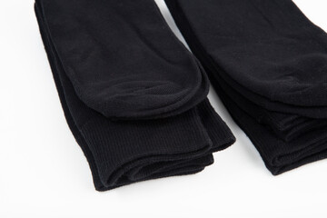 Black men's socks made of cotton on a white background.