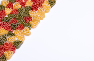 Italian tricolor, heart shaped pasta on white background with copy space