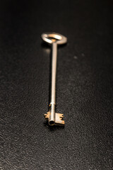 a long safe key for a steel safe,