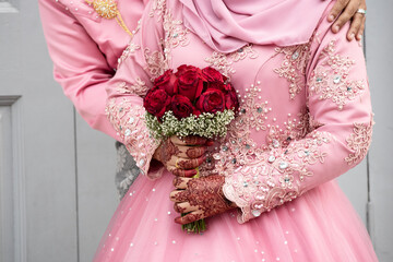 bouquet of roses in the hands of a bride in Georgetown, Penang