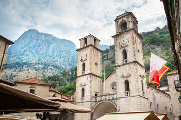 Fototapeta na wymiar Kotor Clock tower with mountains looming from behind,Montenegro,Eastern Europe.