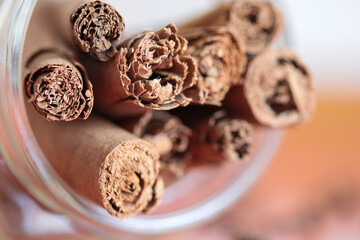 Cinnamon sticks close-up on blurred black background.Selective focus.