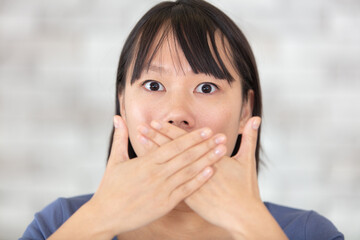 shocked excited beautiful asian woman