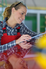 female worker wearing red dungarees