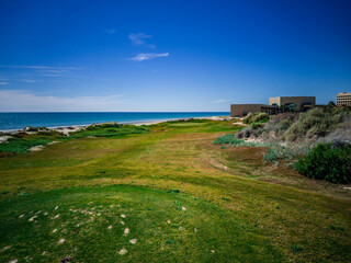 Hole on the Peninsula Golf Course near the Mayan Hotel in Puerto Penasco, Sonora, Mexico on a beautiful winter day with the Sea of Cortez in the background