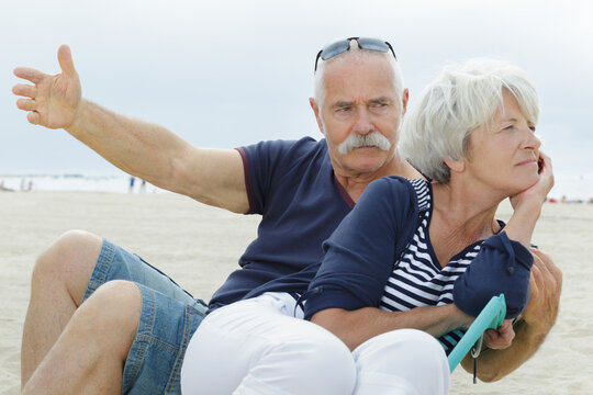 senior couple arguing with each other at the beach - Powered by Adobe