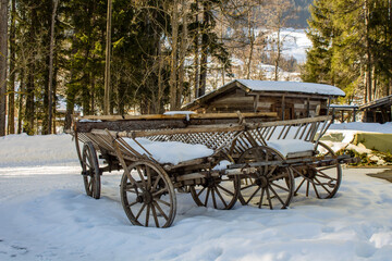 Fototapeta na wymiar Old farm cart in the snow.
