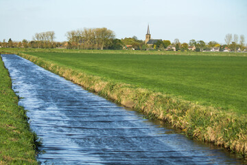 Landscape with village and church.