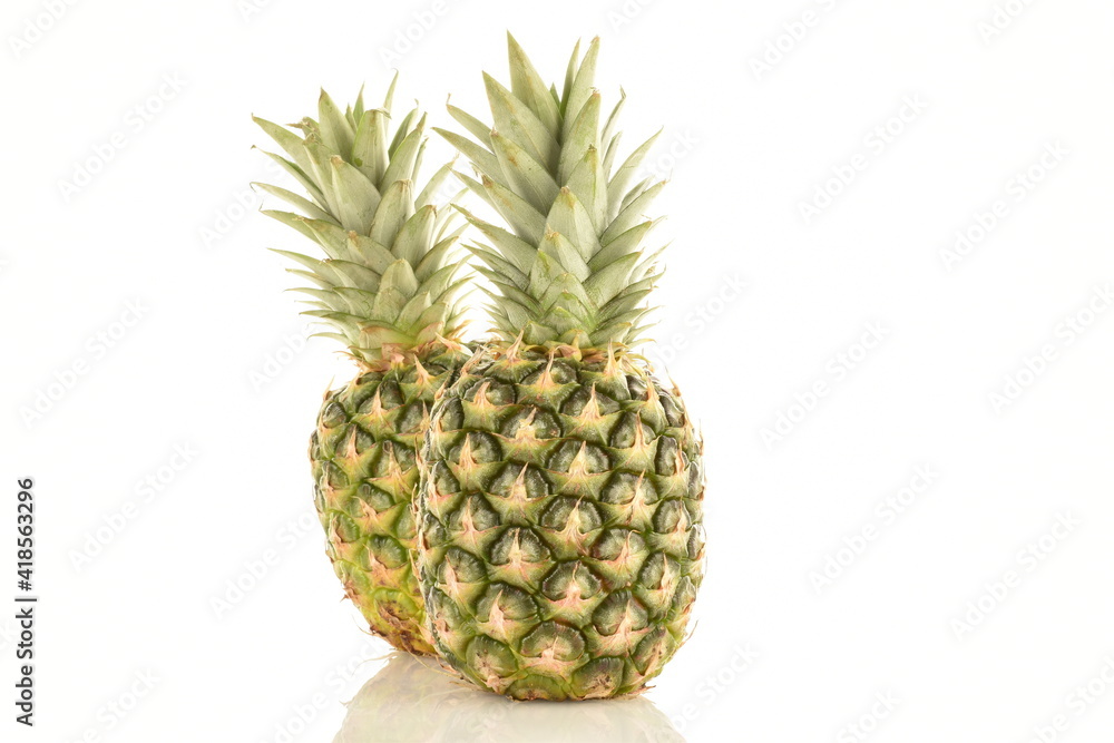 Wall mural two ripe organic pineapples, close-up, isolated on white.