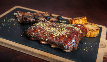 Spicy hot grilled caramelised pork ribs with corn