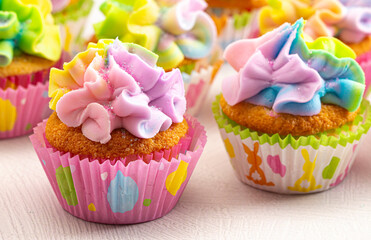 Pastel Rainbow Frosted Easter Cupcakes  on a Kitchen Counter