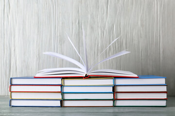 Stacks of books on wooden background
