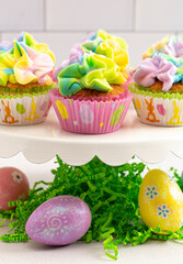 Pastel Rainbow Frosted Easter Cupcakes  on a Kitchen Counter