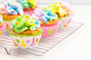 Pastel Rainbow Frosted Easter Cupcakes  on a Kitchen Counter