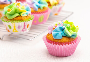 Pastel Rainbow Frosted Easter Cupcakes  on a Kitchen Counter