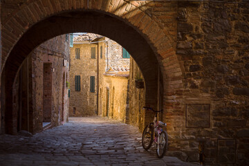 Alley going through a tunnel in Sant'Angelo in Colle, Montalcino, Italy