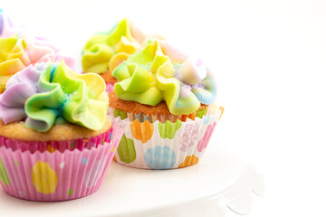 Pastel Rainbow Frosted Easter Cupcakes  on a White Background