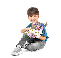 Cute little boy with bouquet of beautiful flowers on white background