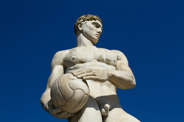 Fototapeta na wymiar Soccer player statue, inscription city of Catanzaro (Calabria), Stadio dei Marmi in Rome