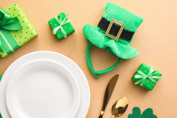 Beautiful table setting for St. Patrick's Day celebration on color background