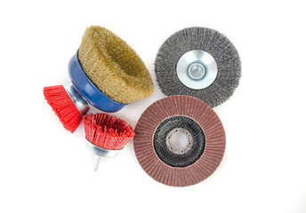 Polishing brushes and grinding discs of an angle grinder isolated on white background
