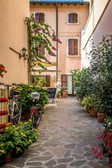 Fototapeta na wymiar A picturesque street of Bardolino, a town on Lake Garda. Veneto, Italy