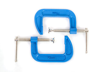 Clamp - professional tool for clamping objects isolated on a white