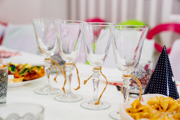 empty glasses on a table served for the children's holiday. 