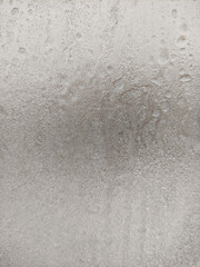 texture of frozen water drops on glass