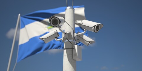 Naklejka na ściany i meble Flag of Nicaragua and four security cameras on the pole, 3d rendering