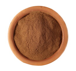 Cinnamon powder pile in clay pot isolated on white background, top view