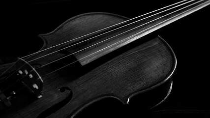 Fototapeta premium close up of a violin with dark background for copy space