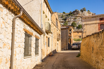 a street with traditional architecture in Castillejo de Robledo, province of Soria, Castile and Leon, Spain