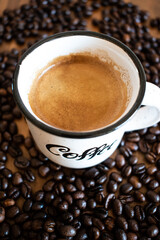 cup of espresso coffee with beans