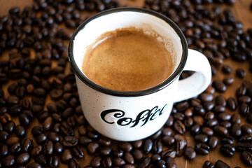 cup of espresso coffee with beans